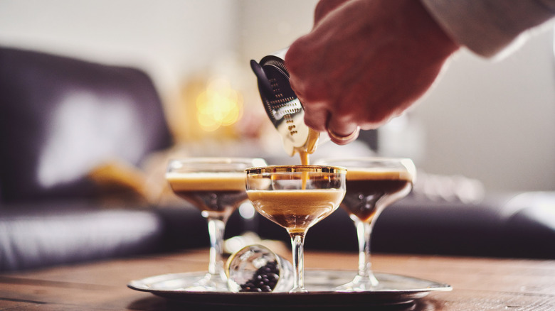 Hand pouring espresso martini