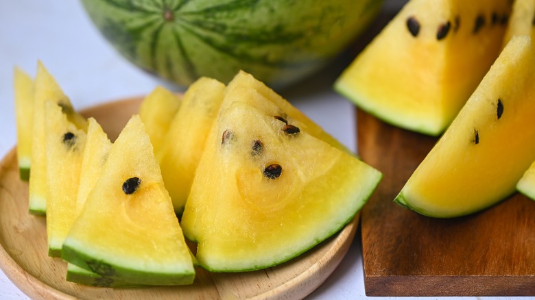 Yellow watermelon slices on plate