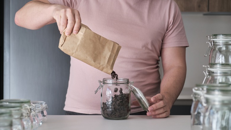 Pouring chocolate chips into container