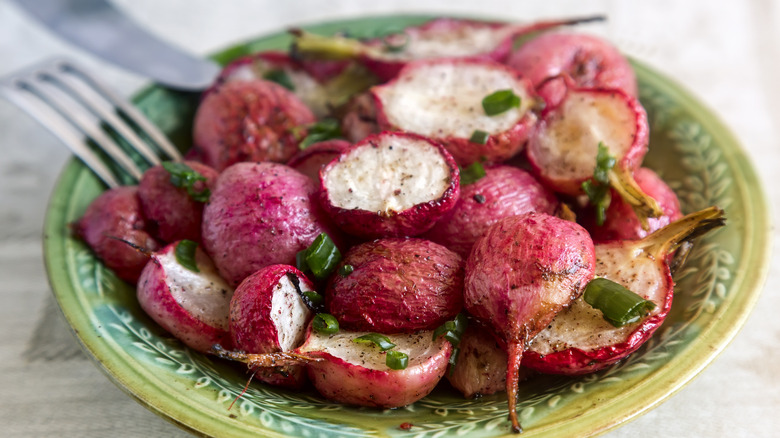 roasted radishes on a green plate