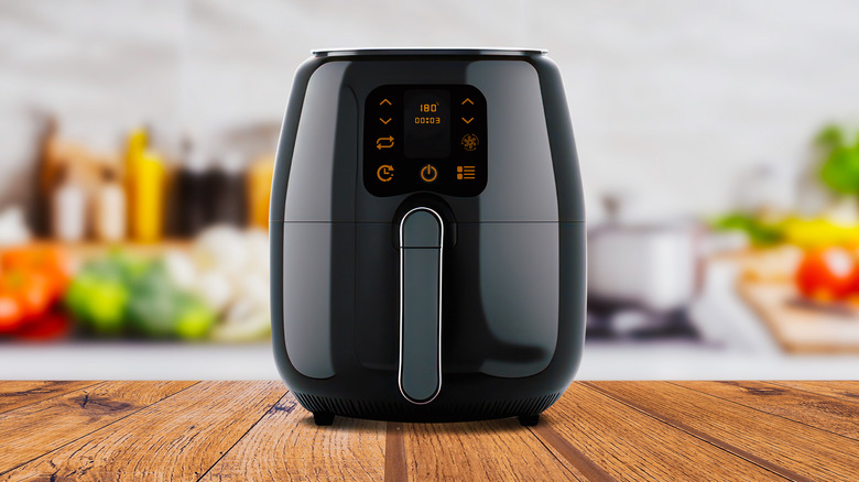 Air fryer on a wooden countertop