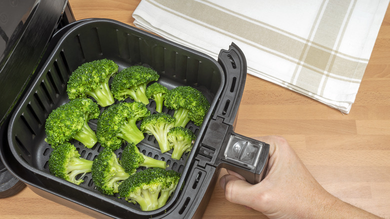 broccoli in an air fryer basket