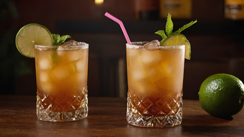 Caramel colored rum cocktails with lime