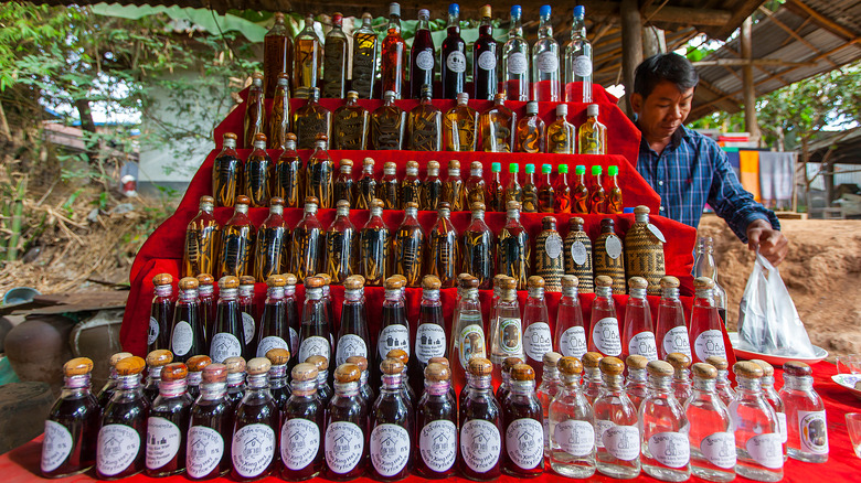 person selling rice whiskey