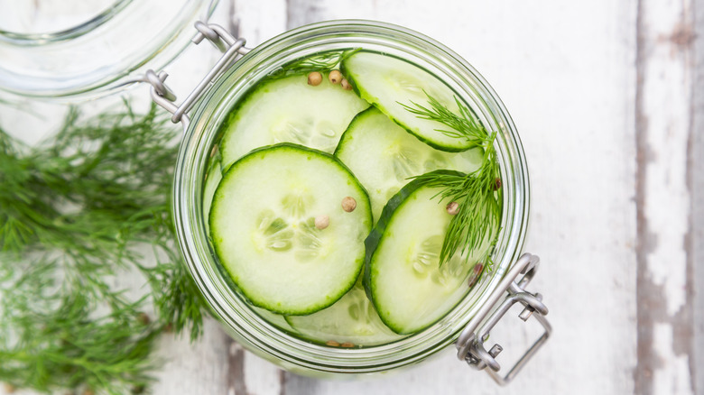 Sliced pickles in mason jar