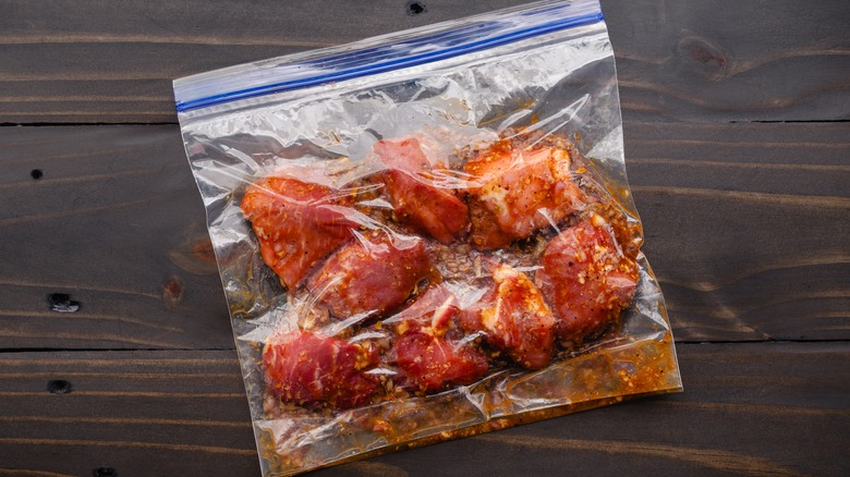 Meat marinating in a bag