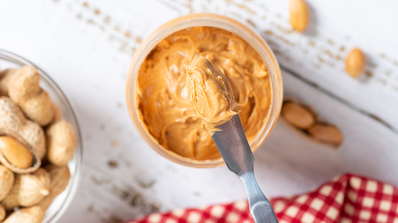 chunky peanut butter on knife