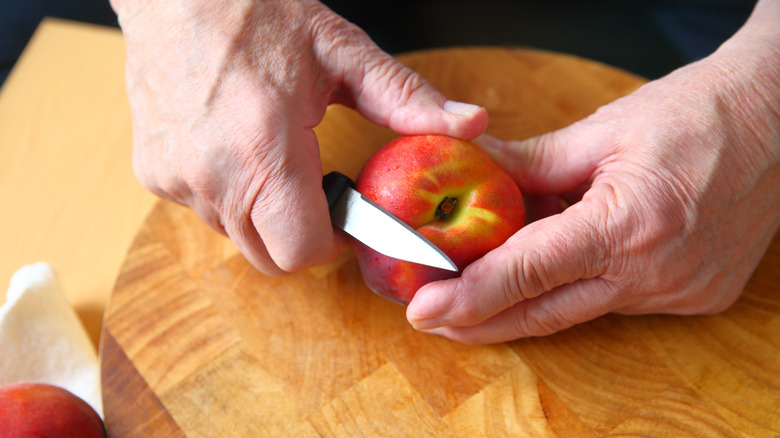 peeling apple with paring knife