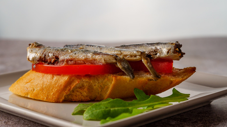 Canned sardines and tomato on bread