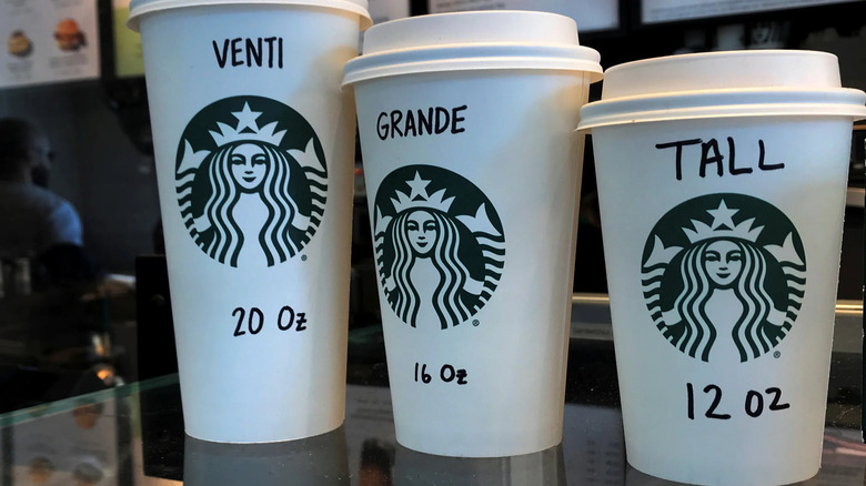 three Starbucks cups