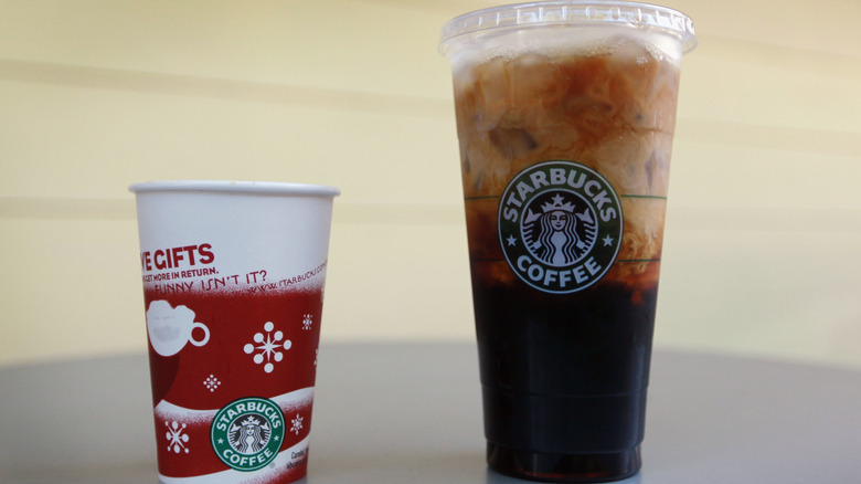 trenta Starbucks cup next to a tall Starbucks drink