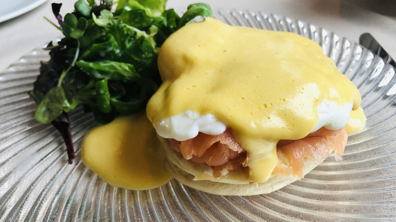 Eggs Benedict variation topped with hollandaise sauce