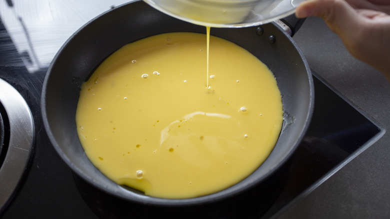 Pot of finished hollandaise sauce on stove