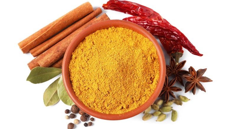 curry powder with surrounding spices