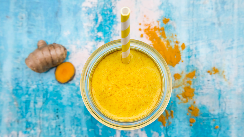 spiced golden drink with straw