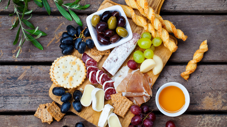 Picnic appetizers on cutting board