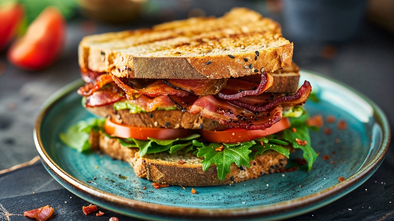 BLT sandwich on teal plate