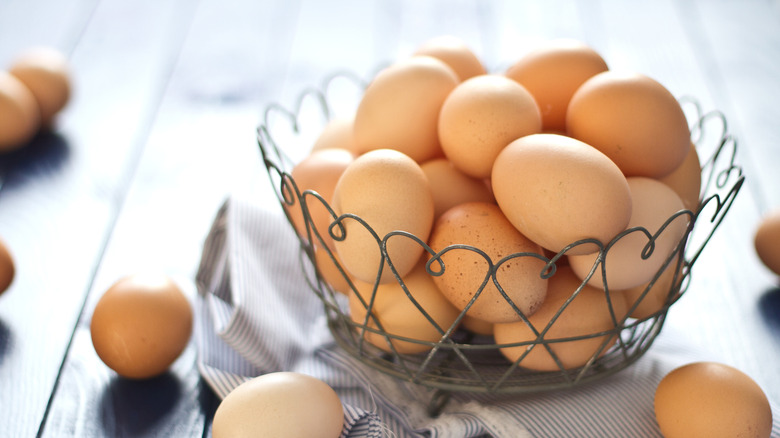 Farm fresh eggs in a wire basket