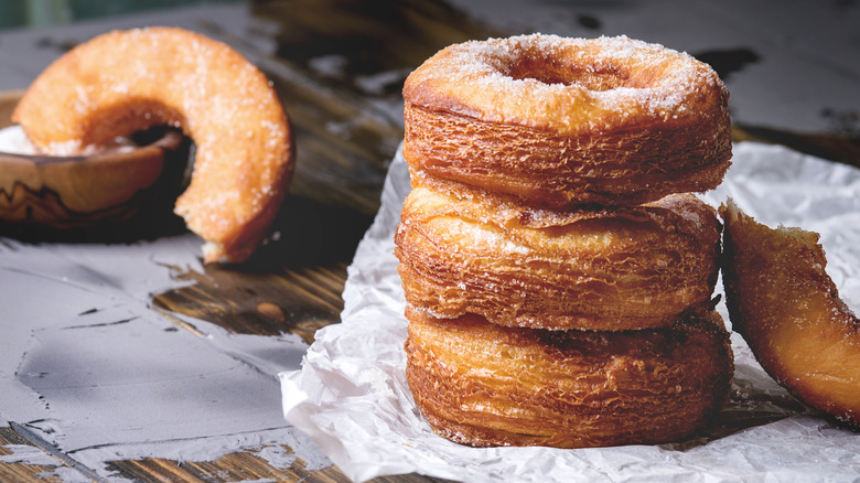 Stack of fried croissant donuts with sugar