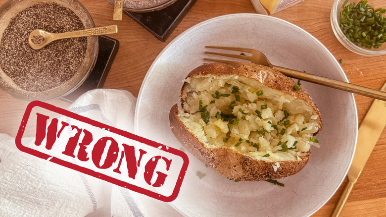 Plated baked potato on table