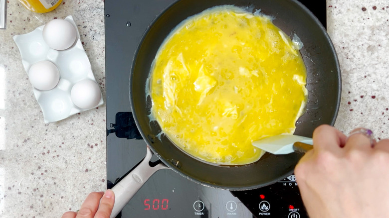 Aerial view of eggs cooking in pan