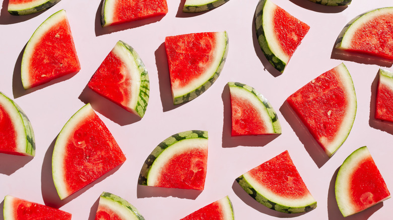 Watermelon slices on pink background