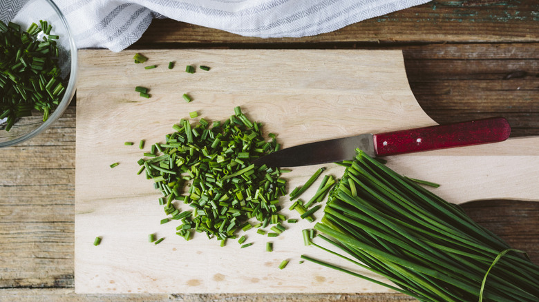 sliced chives on cutting board