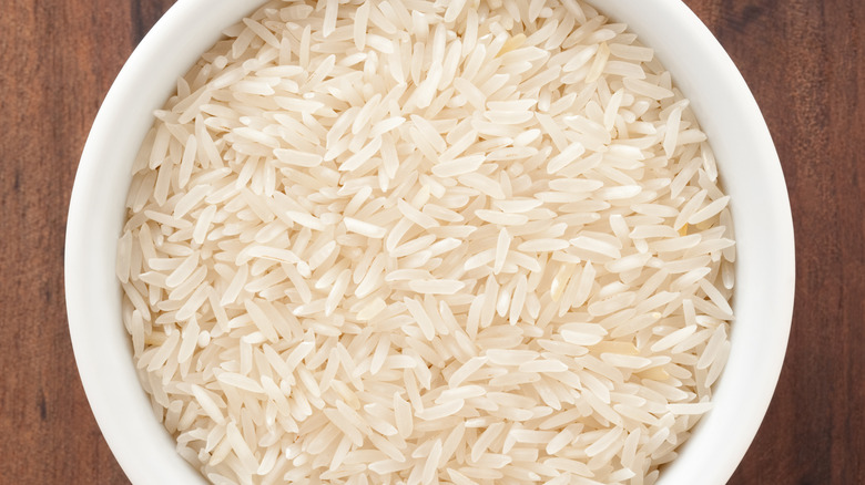 grains of dry basmati rice in white bowl