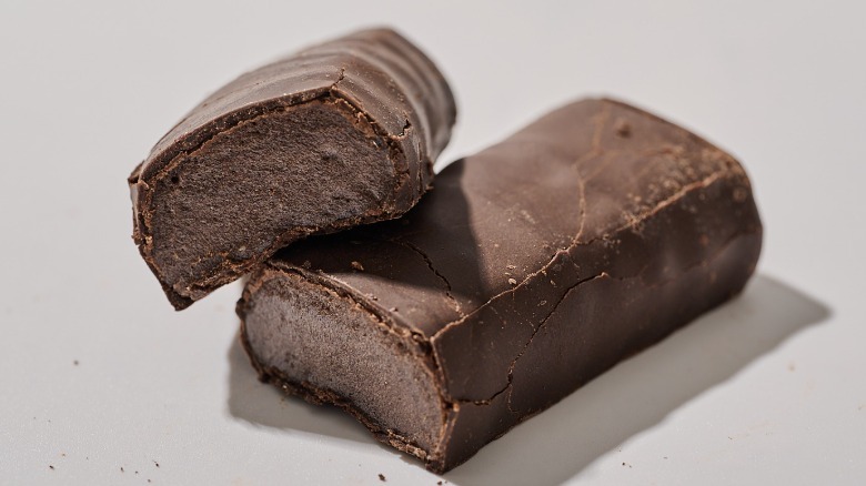Protein bar cut in half on a table