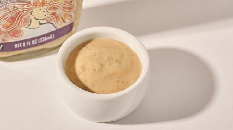 cup of dressing on a table