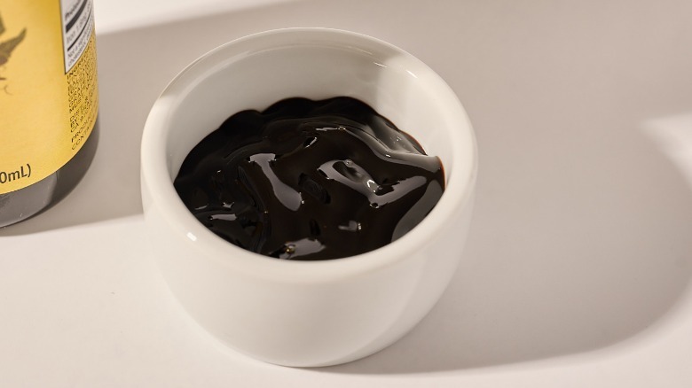 Cup of dressing on a table