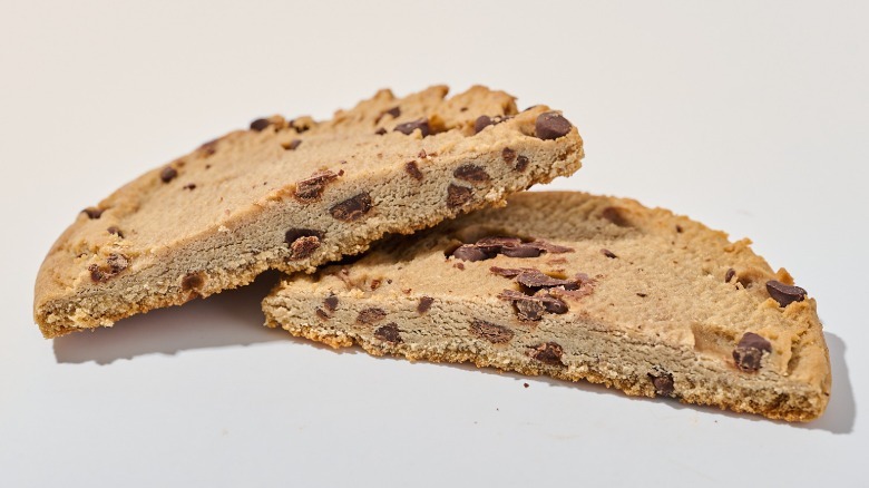 Protein cookie cut in half on a table