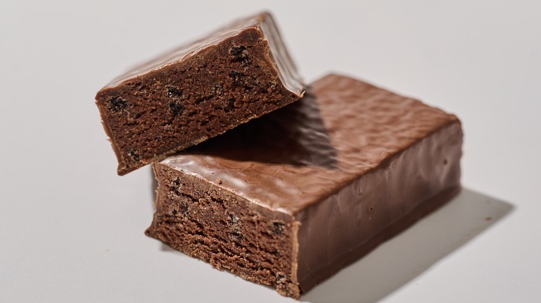 Protein bar cut in half on a table