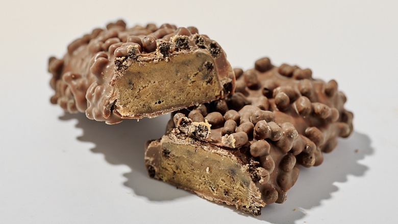Protein bar cut in half on a table