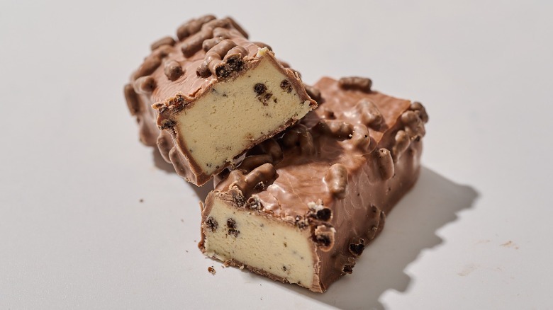 Protein bar cut in half on a table