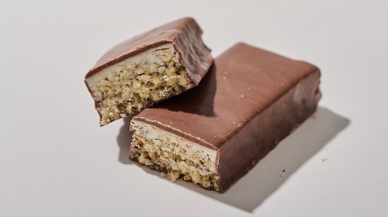 Protein bar cut in half on a table